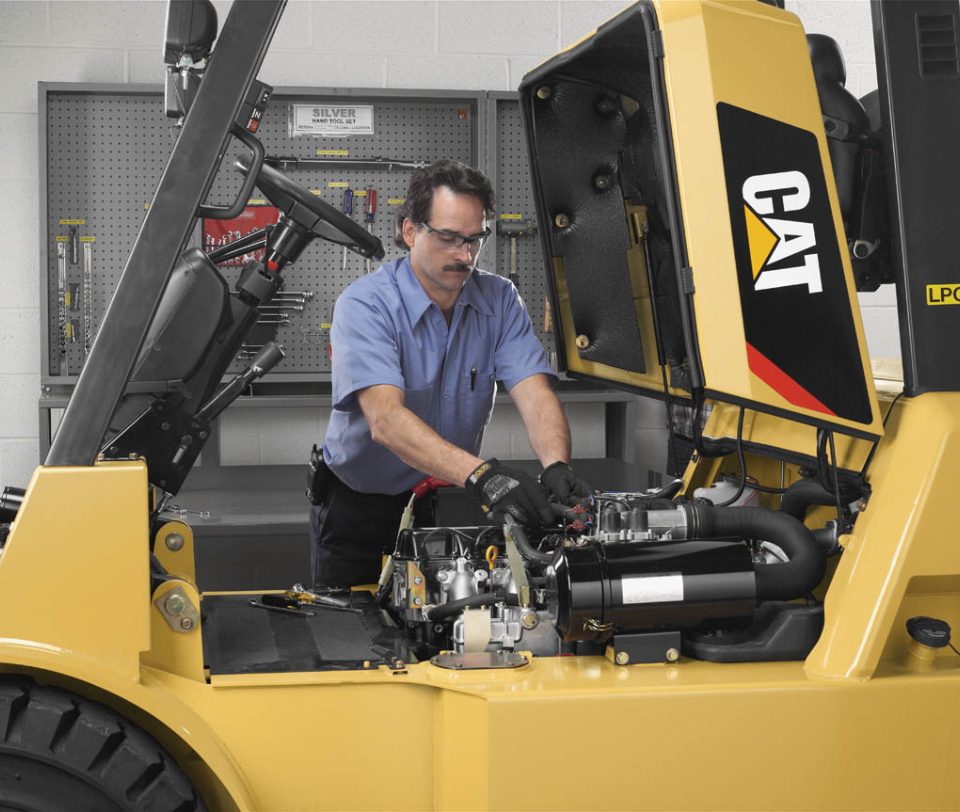 Holt of California employee servicing Lift Equipment in workshop