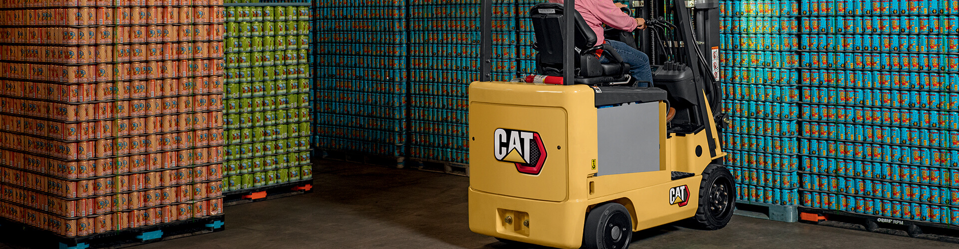 Cat electric forklift packing cans of soda in a warehouse
