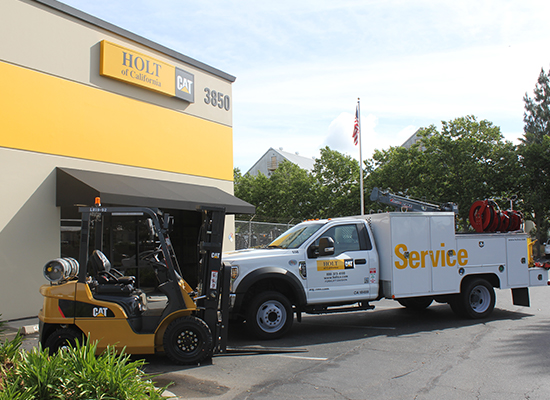 Cat forklift and service truck outside Holt of California location